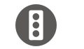 white traffic light icon on a dark gray circle
