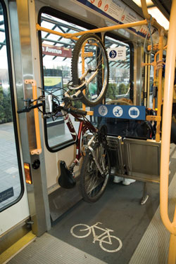 Photo of bike hanging from bike hook on MAX train
