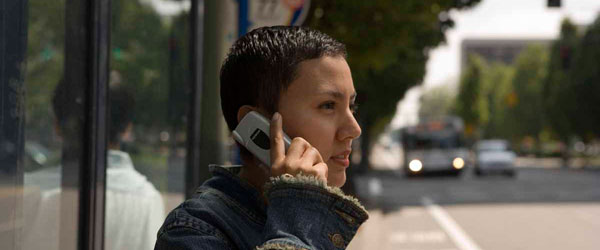 Woman accessing TransitTracker on a mobile phone