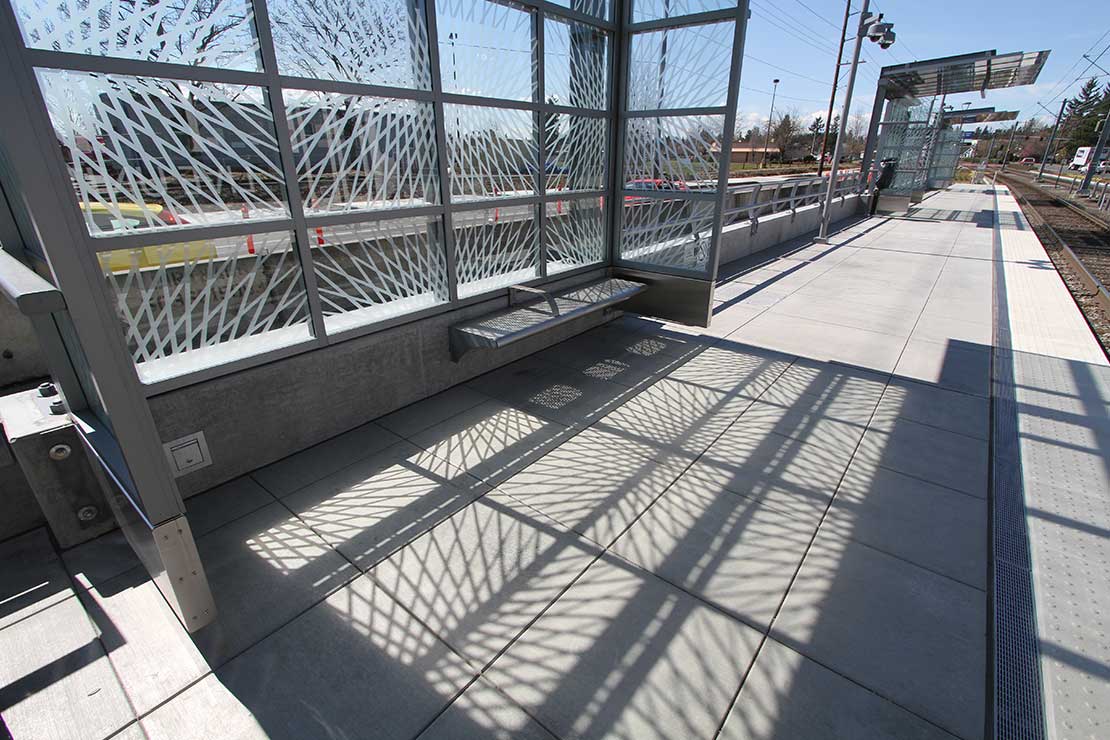 Windscreens at Rockwood cast veined shadows on the sidewalk
