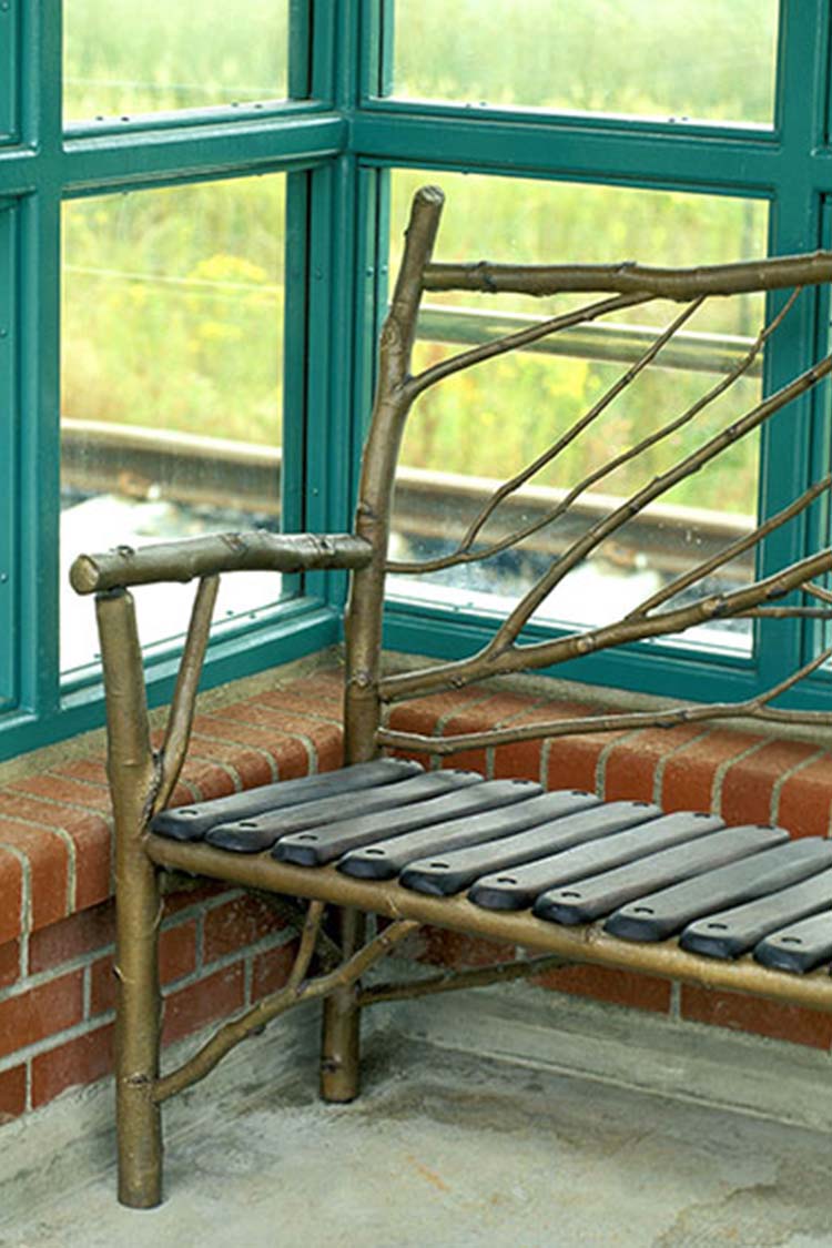 Bench crafted from gold painted tree branches