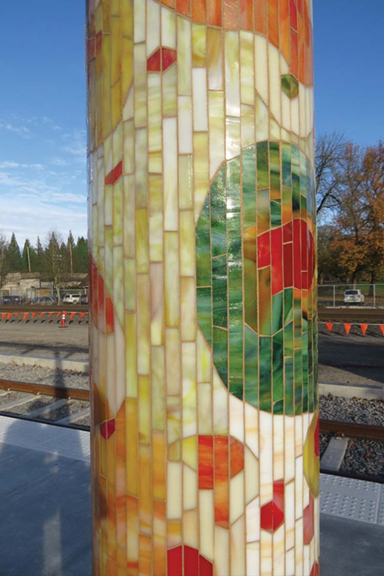 'Journey Through Time' bus shelter column decorated in moasic  inspired by the Rhododendron Garden