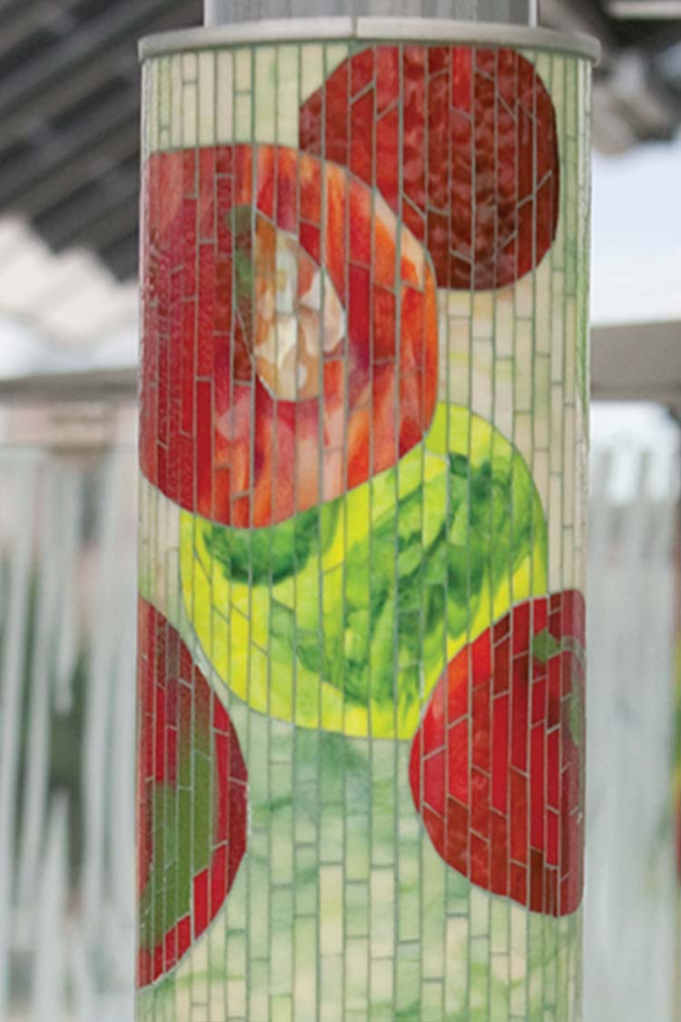 'Journey Through Time' shelter column with mosaic tile apples