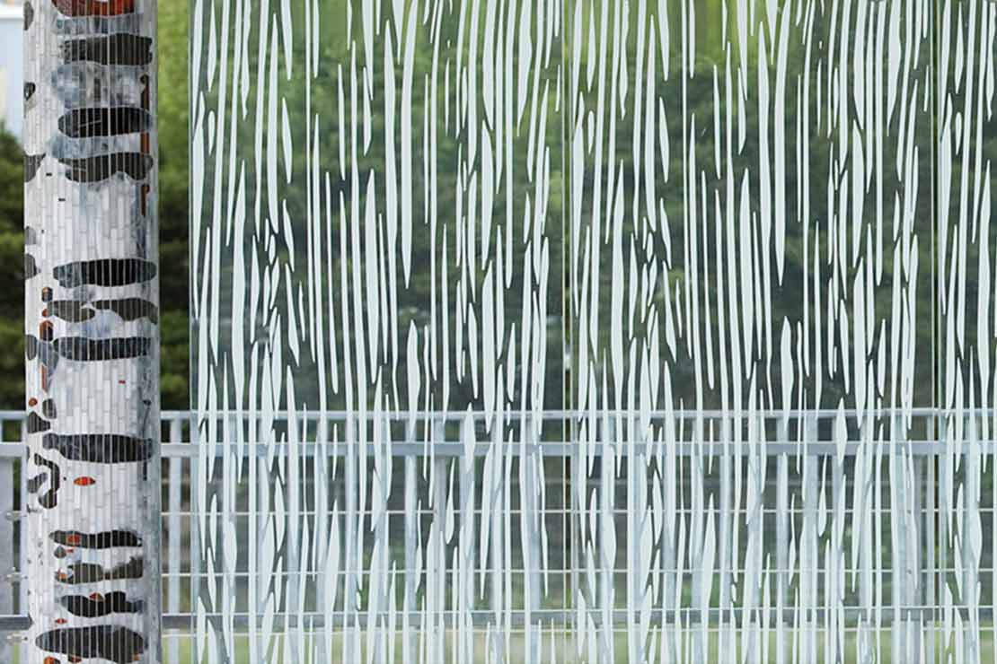 Etched glass pattern based on flowing water and wood grain